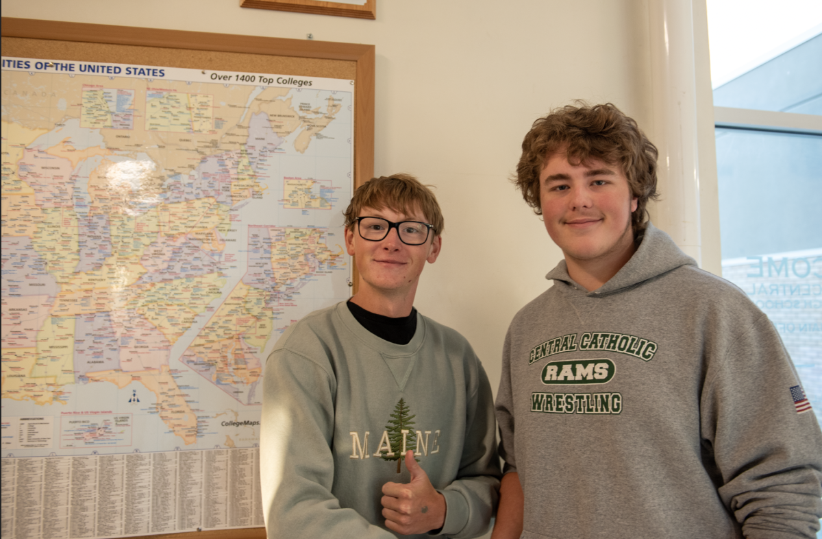 (For social media)10.7.24 (From to L to R) Seniors Nolan Harada and Kirkallen Hoskins stand in front of the college pin board at the entrance of Billings Central. 